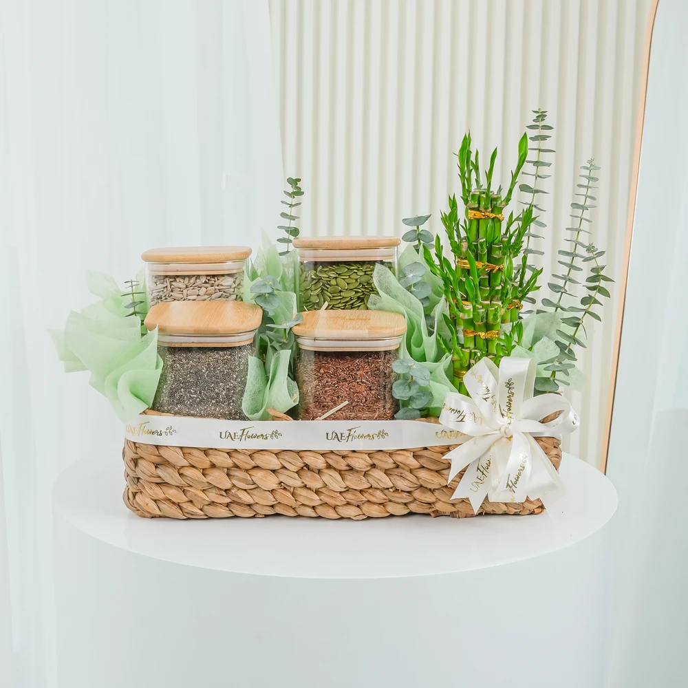 250 Gms of Sunflower Seeds, 250 Gms of Flax Seeds, 250 Gms of Pumpkin Seeds, 250 Gms of Chia Seeds and 3 layers lucky bamboo with eucalyptus leaf in a basket.