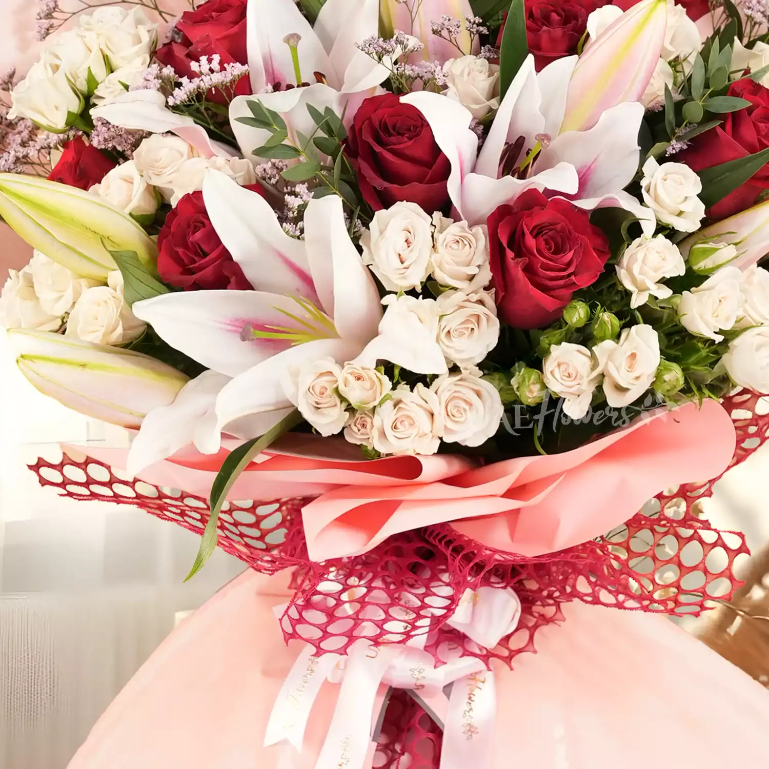 Butterfly bouquet with 2 pink lilies, 10 red roses, and 5 white spray roses