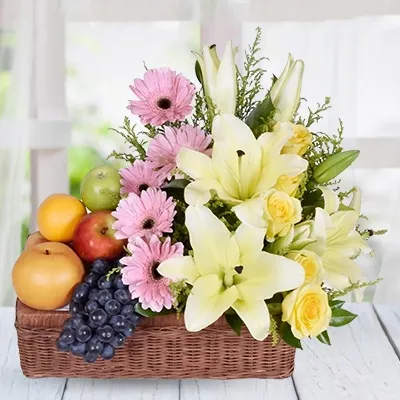 The arrangement of mixed seasonal fruits and seasonal flowers in a beautiful basket