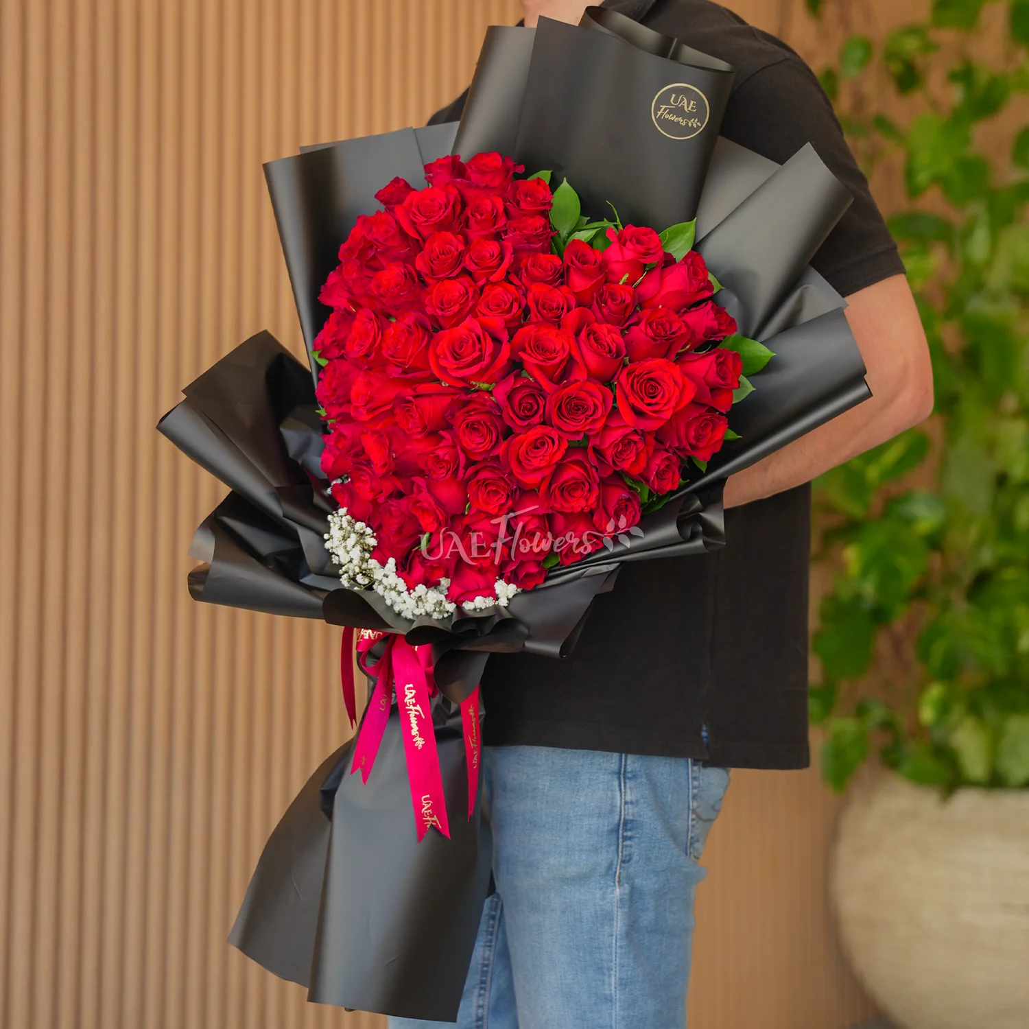 bouquet of 50 red roses in heart shape with baby's breath fillers