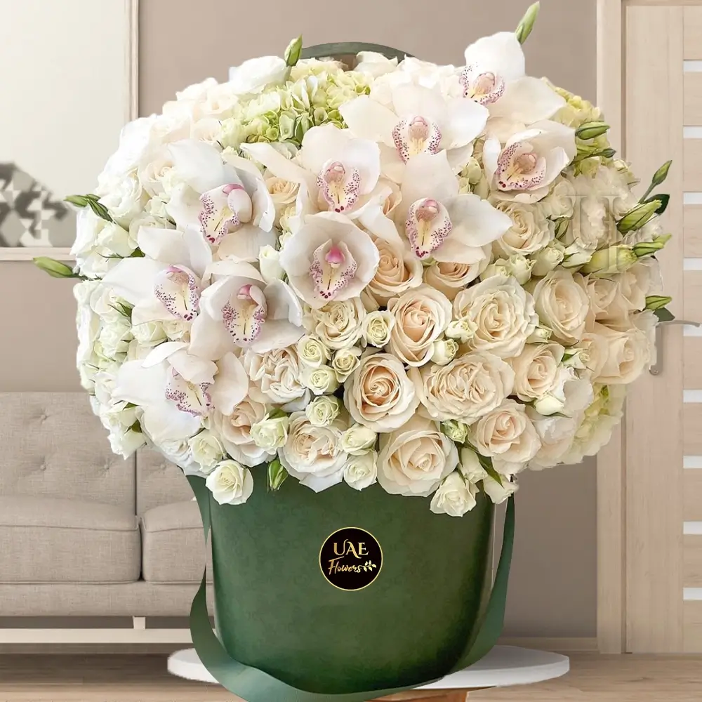 40 white roses, 10 white spray roses, and 2 white cymbidium orchids with fillers in a box