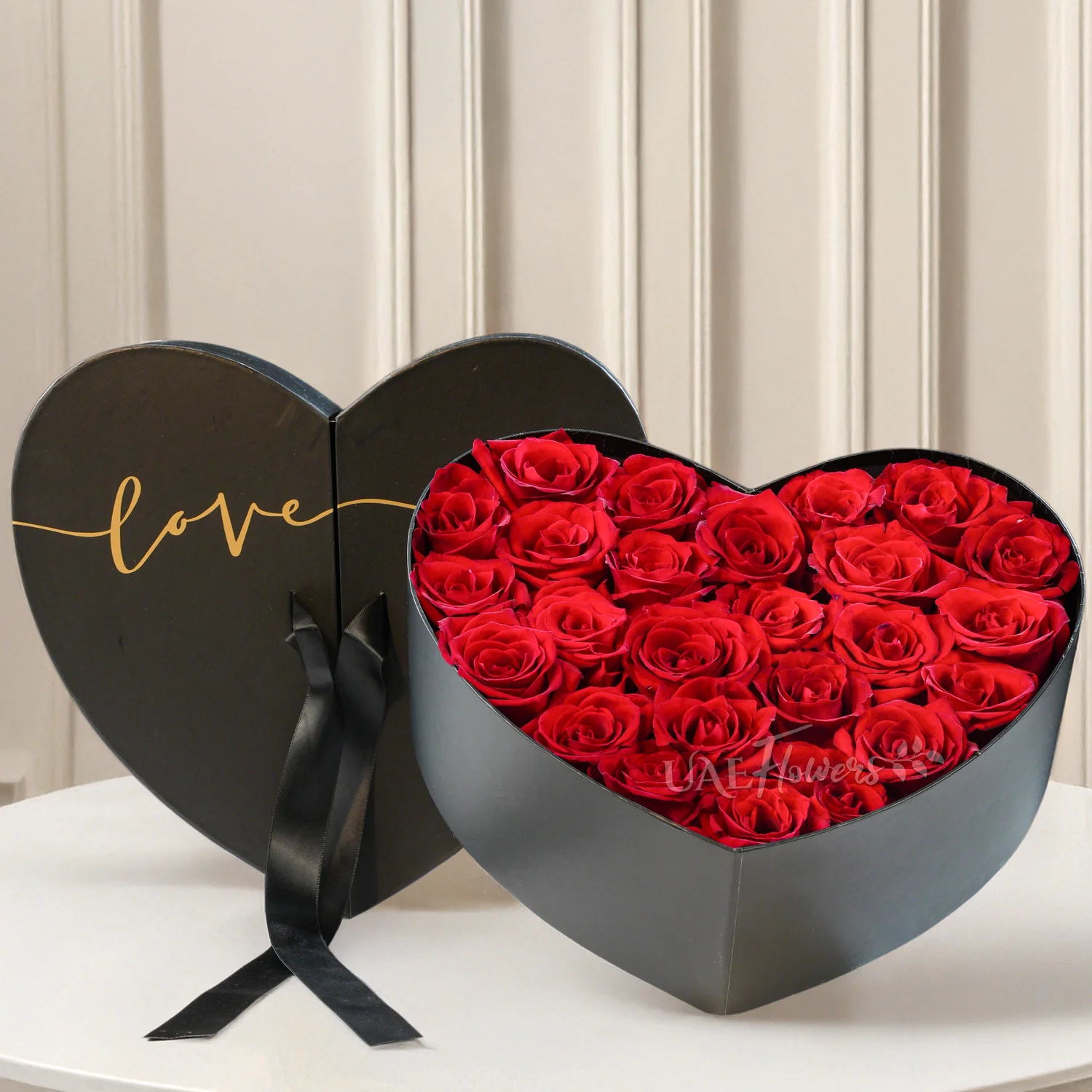 heart-shaped box with 25 red roses