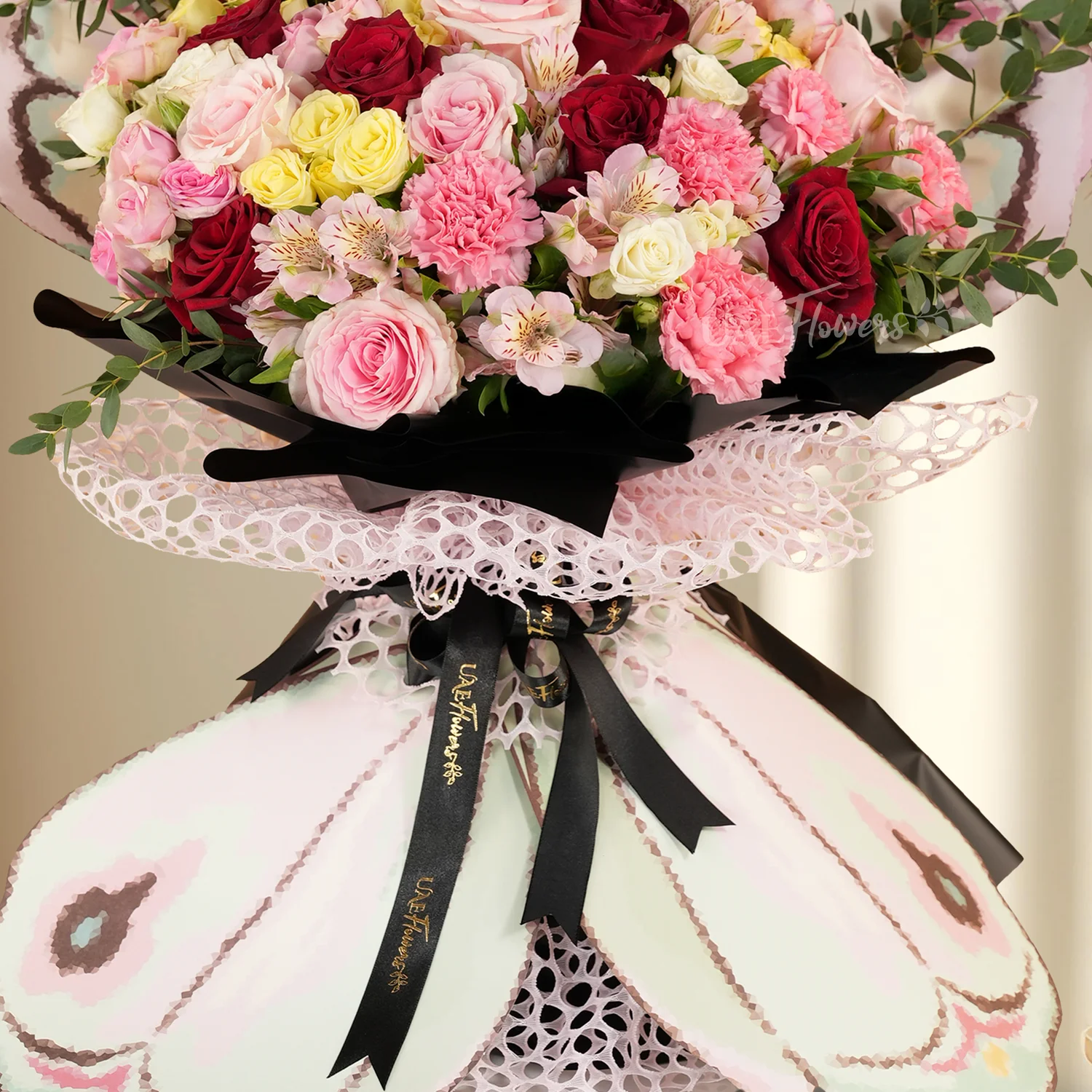 7 red roses, 5 pink roses, 8 pink carnations, 2 pink, 2 white, 2 yellow spray roses, 3 pink alstroemerias