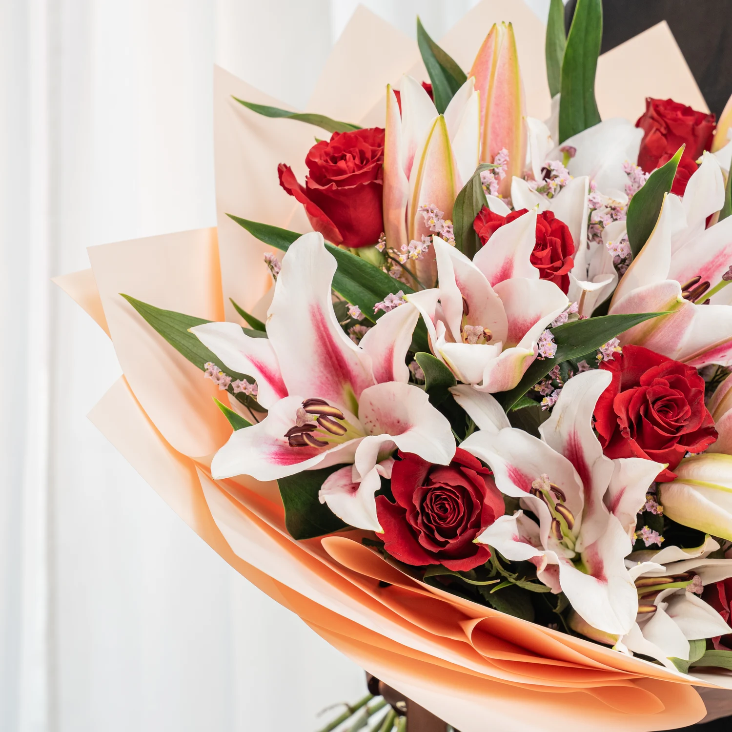 red roses, pink stargazer lilies
