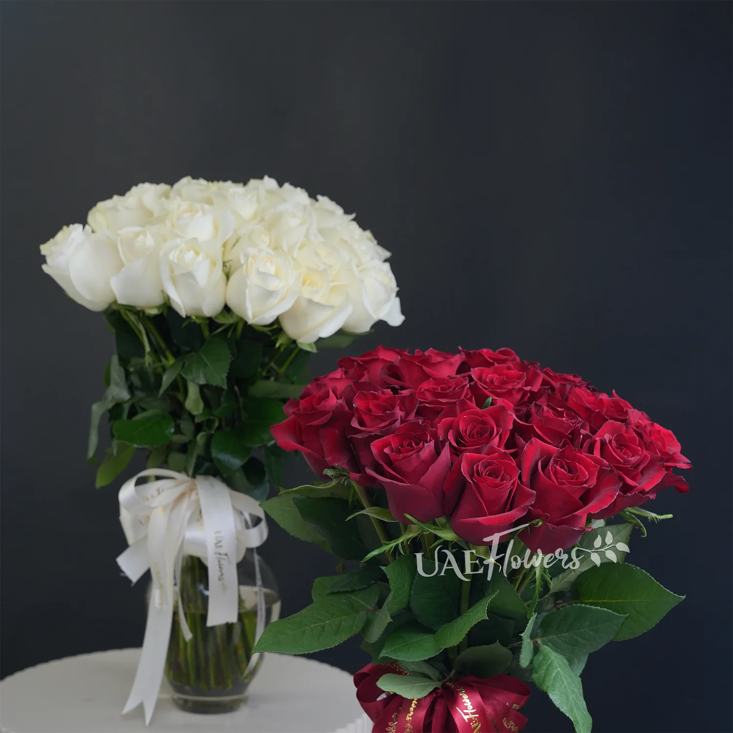 twin vases of 40 red & 40 white roses with fillers