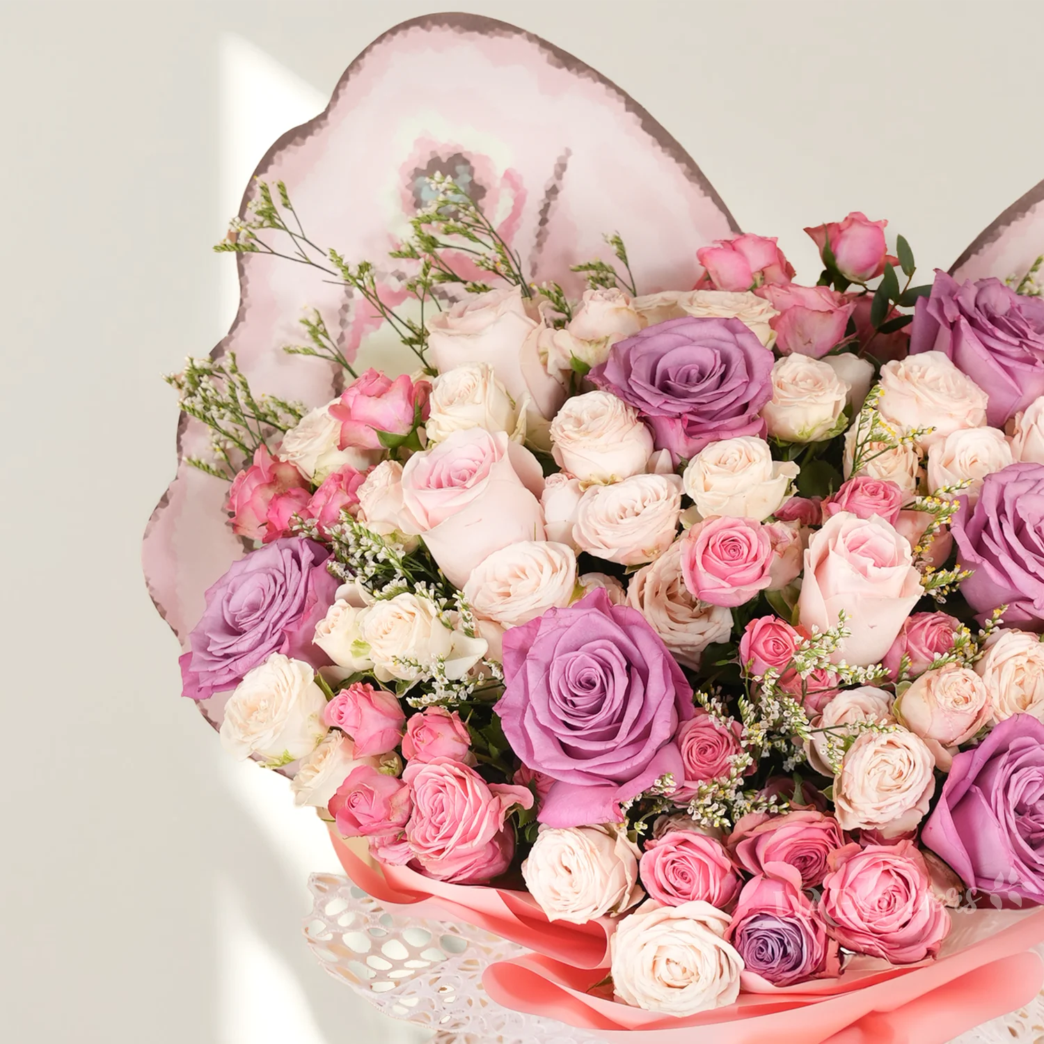 6 purple, 4 pink, and 10 pink and peach spray roses.