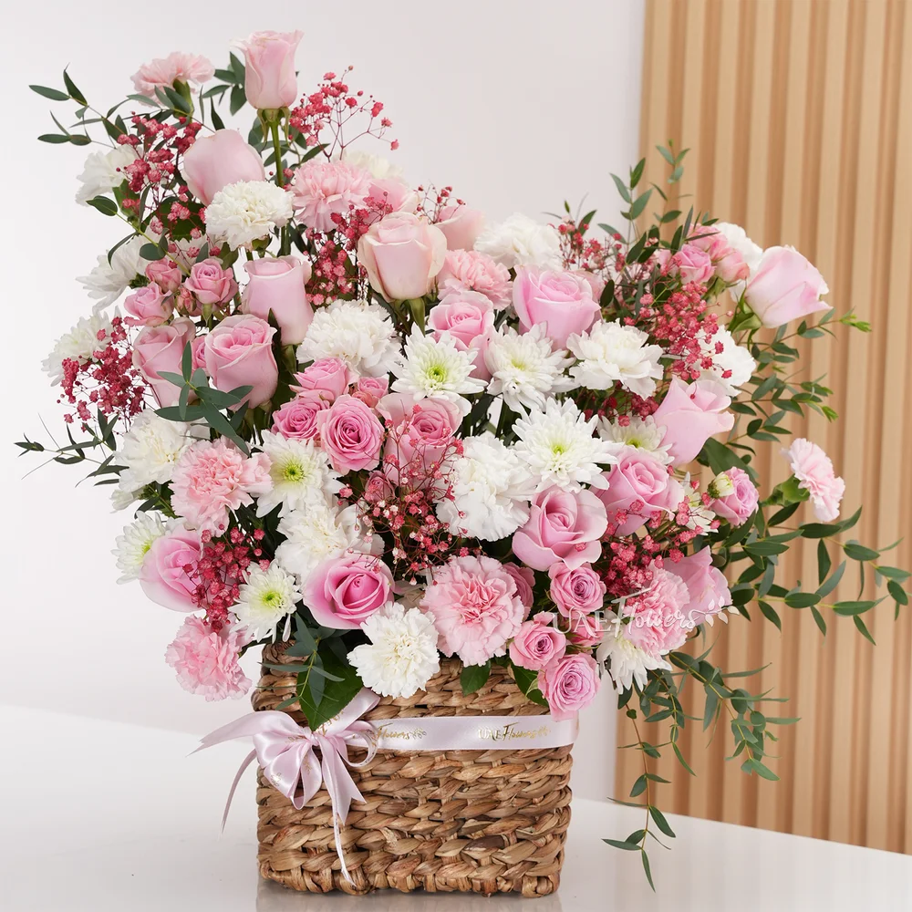 15 pink roses, 12 pink and white carnations, 5 pink spray roses,