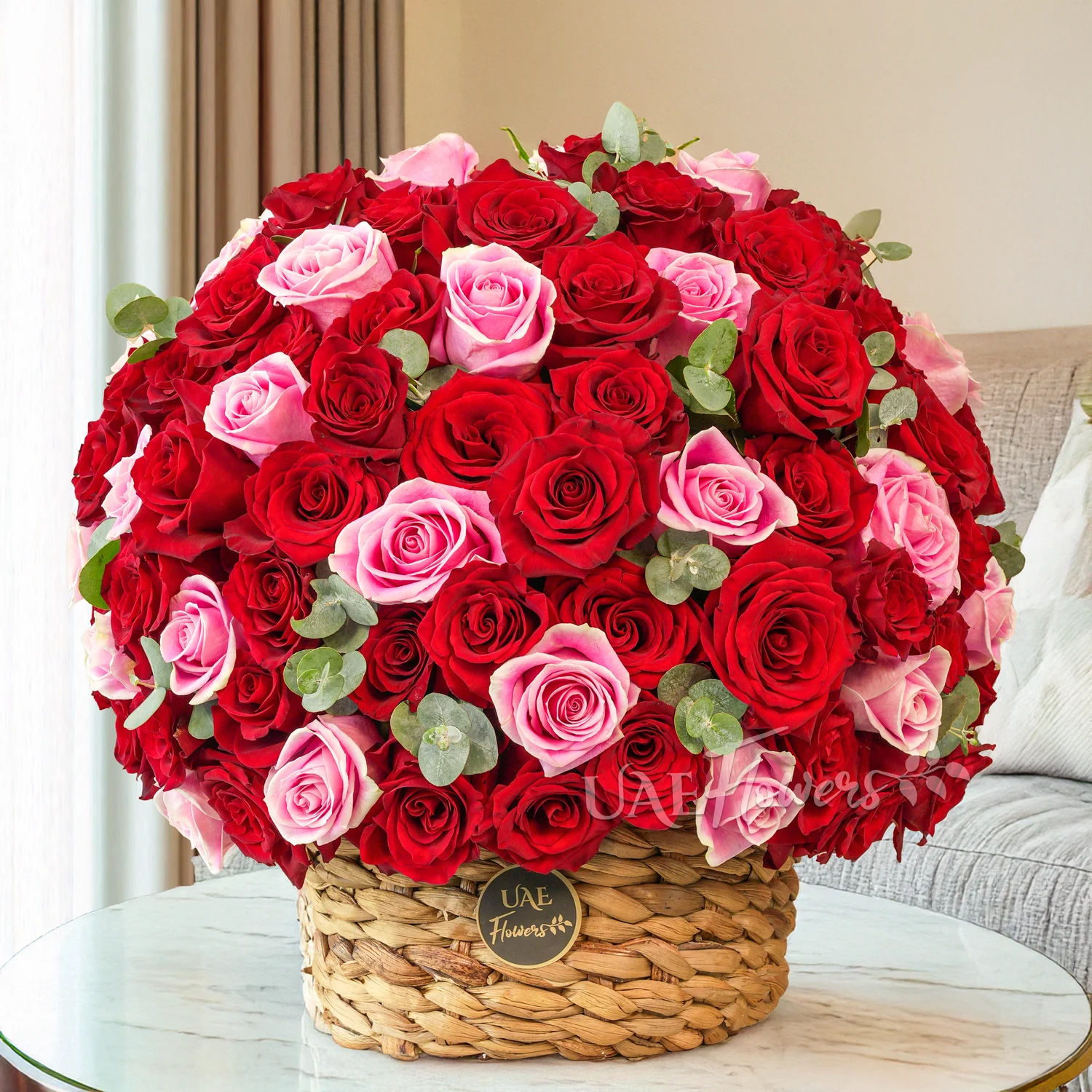 basket with 60 red and pink roses