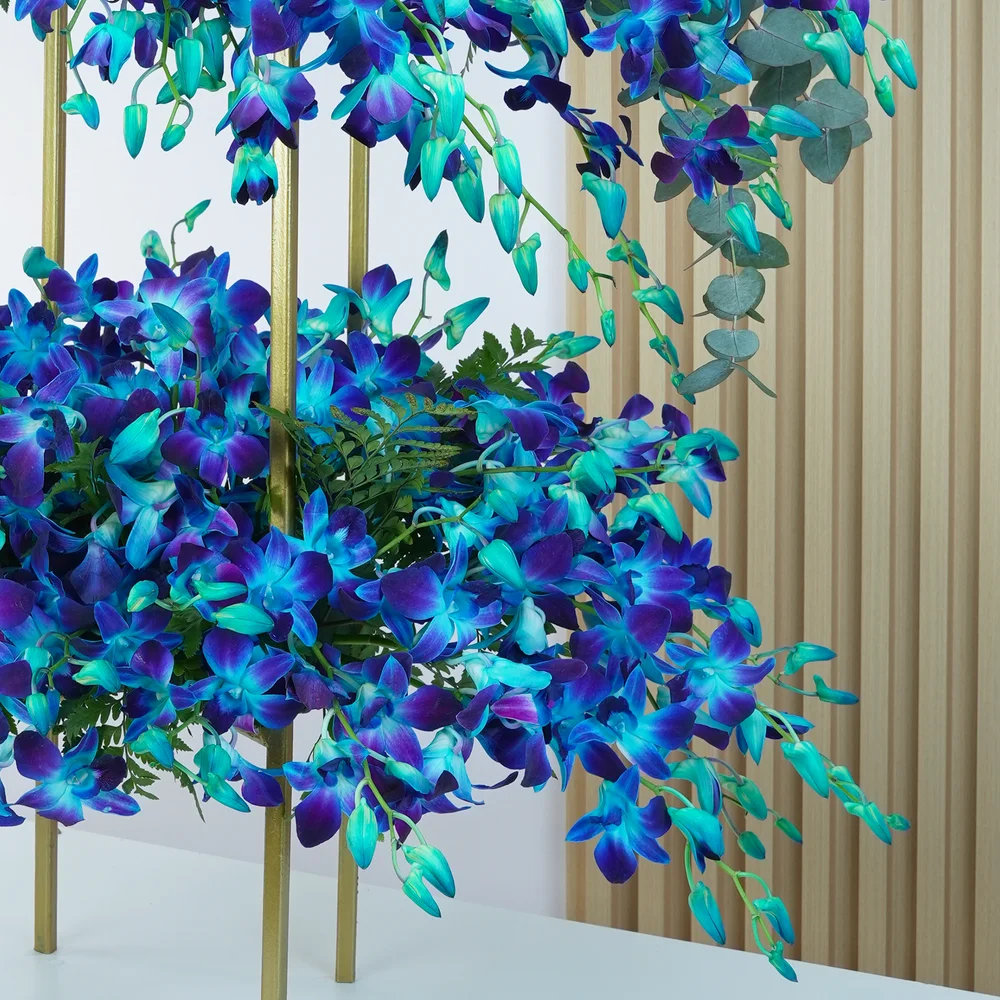 100 blue orchids arranged on a stand