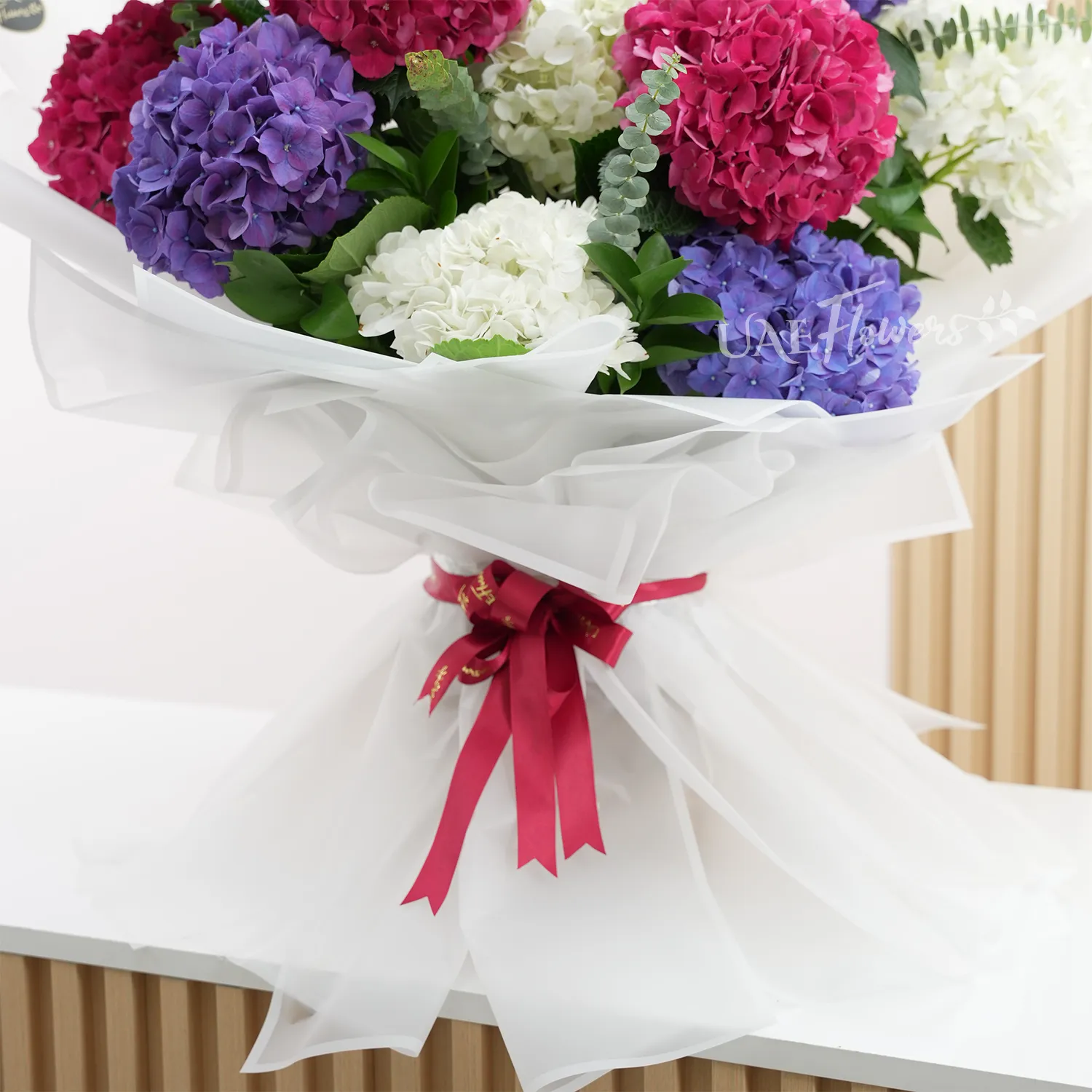 bouquet with red, white, and purple hydrangeas